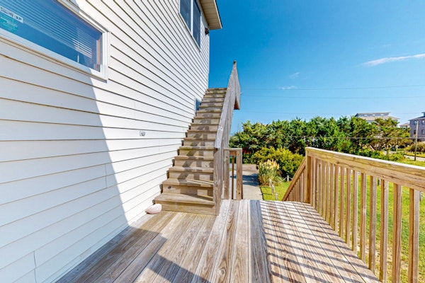 Charming water view home with pool access, decks & outdoor shower - dog-friendly