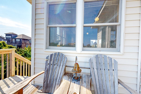 Charming water view home with pool access, decks & outdoor shower - dog-friendly