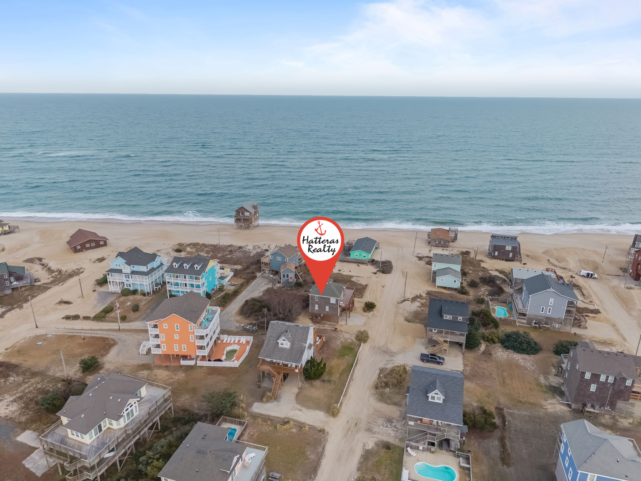 Enjoy a semi-oceanfront getaway, just two houses away from easy beach access!