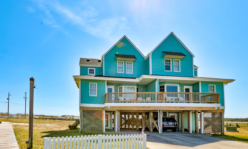 Gorgeous ocean-view townhouse with central AC, private W/D, patio, & pool access