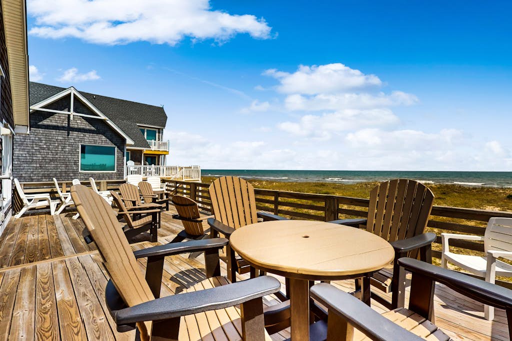 Three-story beachfront home with private pool, hot tub, decks, & ocean views