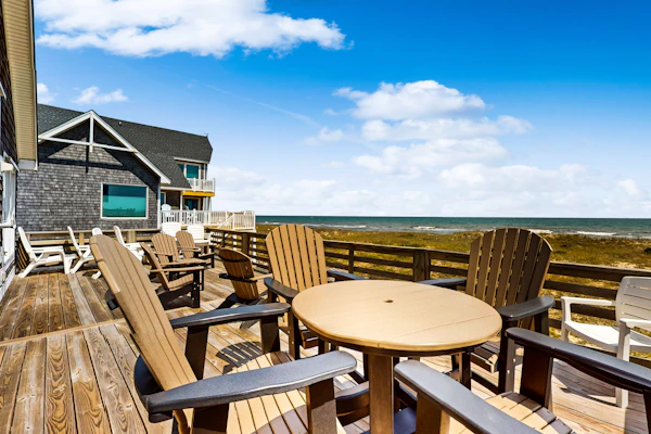 Three-story beachfront home with private pool, hot tub, decks, & ocean views