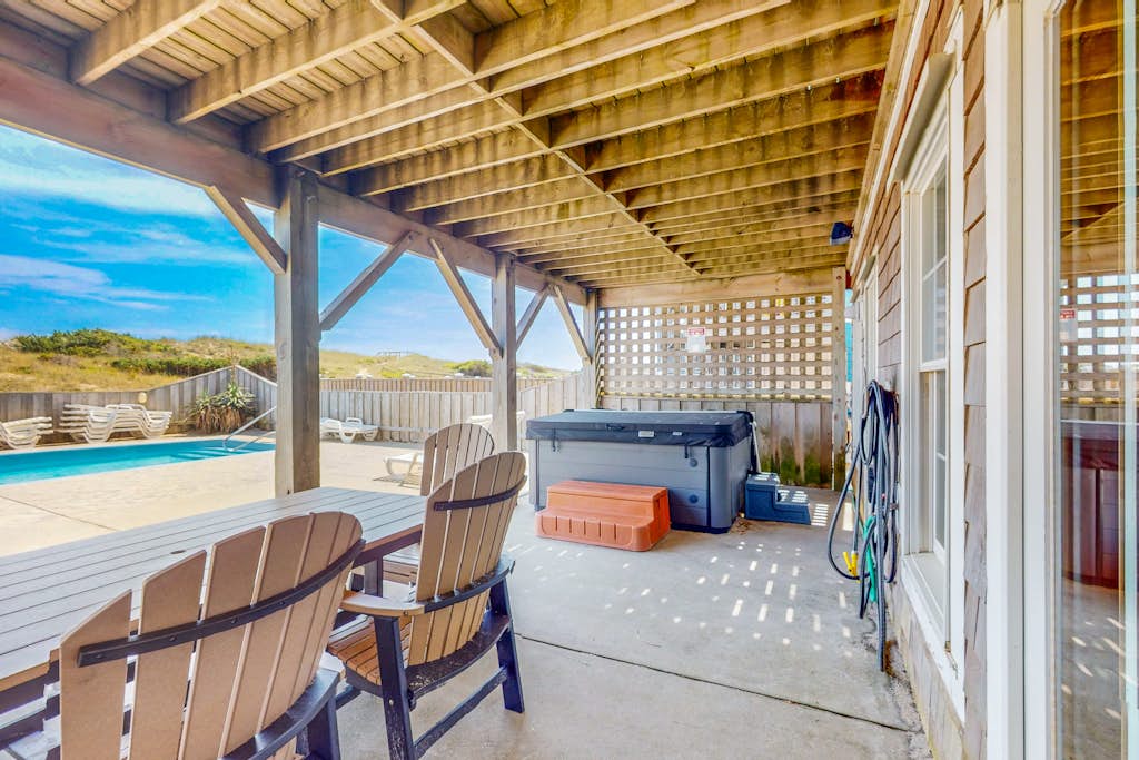 Three-story beachfront home with private pool, hot tub, decks, & ocean views