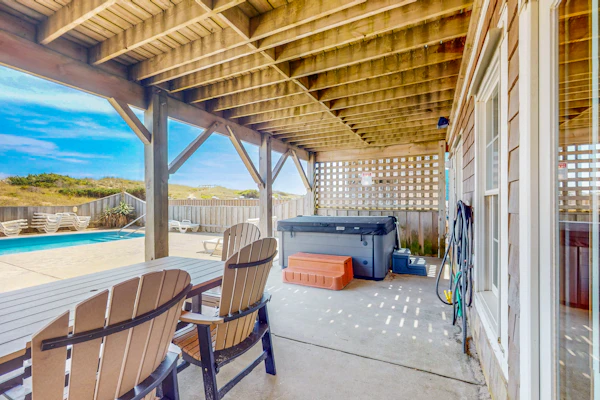 Three-story beachfront home with private pool, hot tub, decks, & ocean views