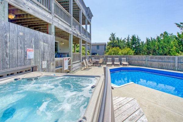 Friendly home with private hot tub, pool, multiple decks, & game room