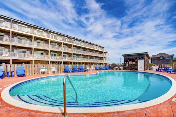 Oceanfront condo with private balcony, hot tub, outdoor pool, & pool table