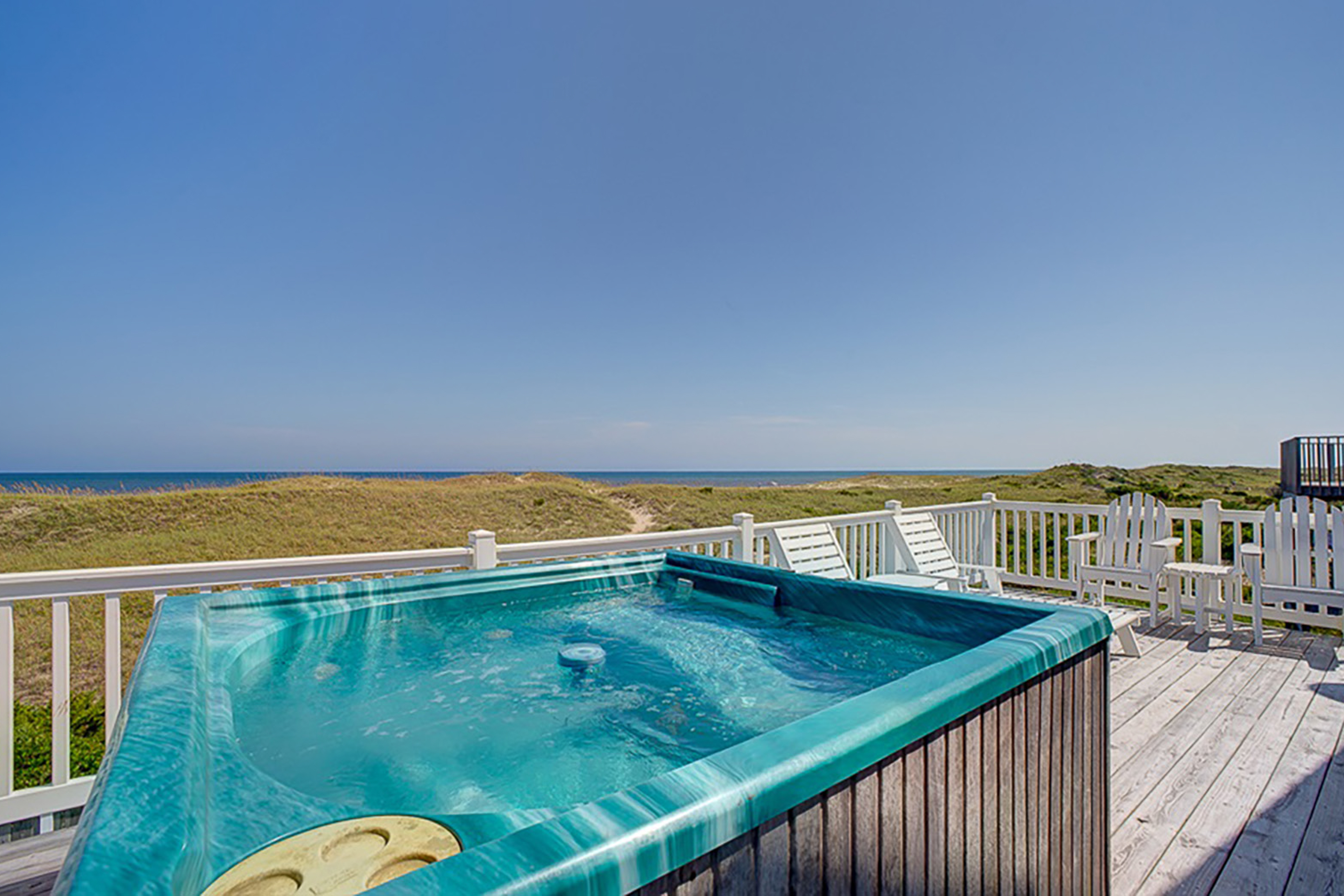 Luxury beach home with beach view, private hot tub, & fireplace