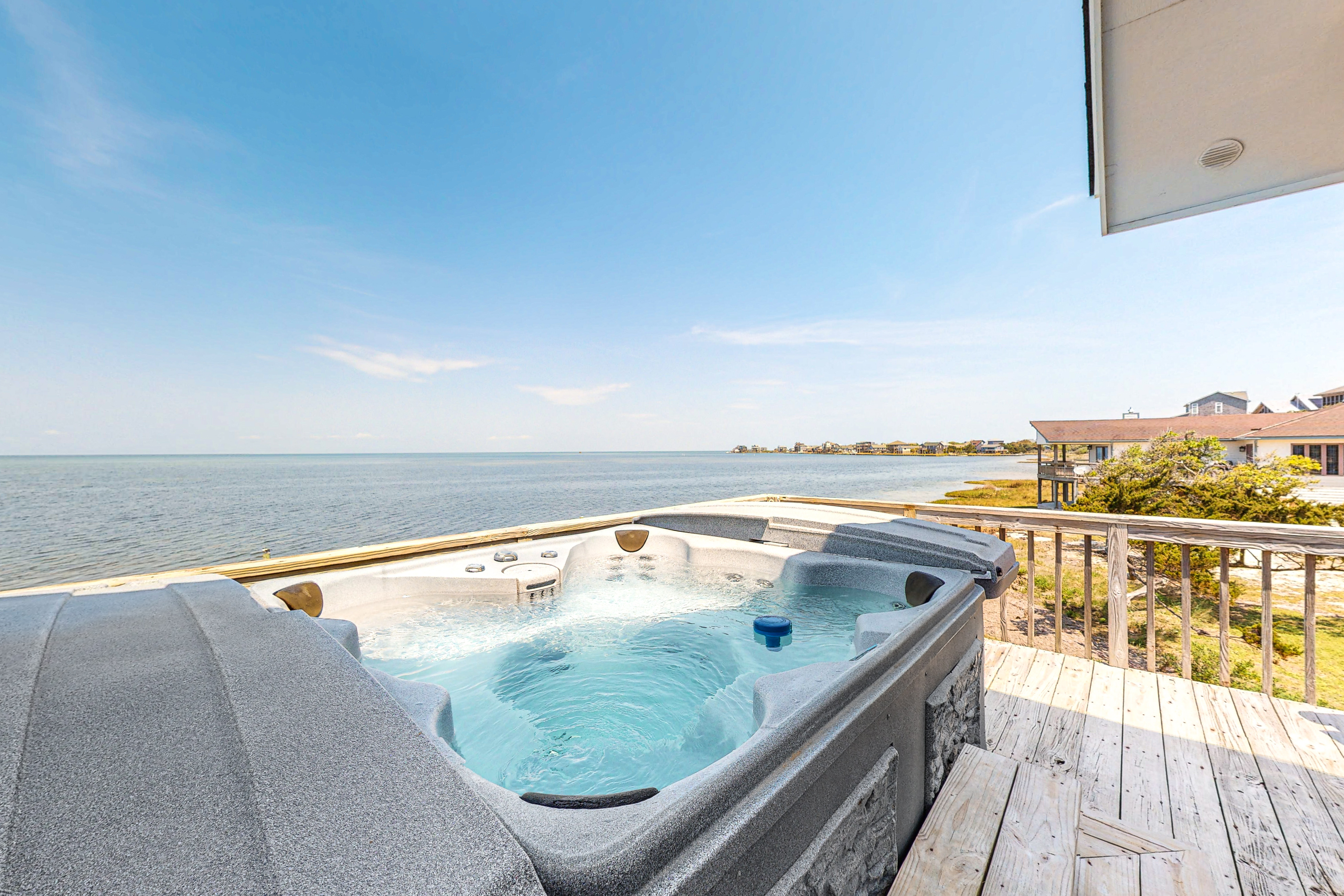 Waterfront, dog-friendly house with pool, W/D, private hot tub, & AC