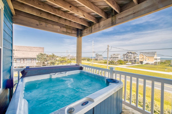Dog-friendly home with hot tub, sunset sound view, & game room