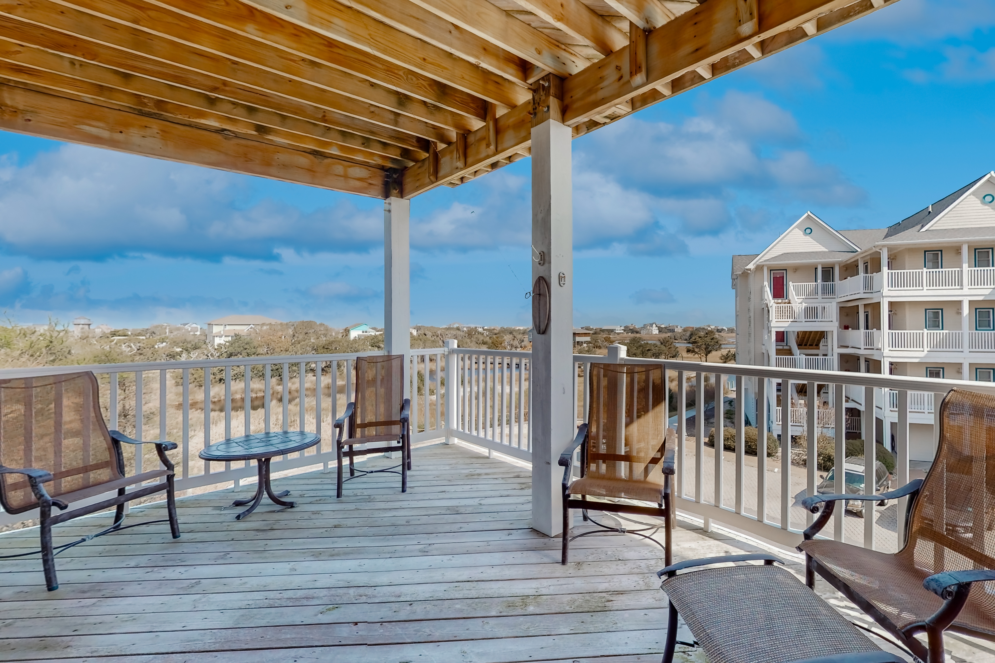 Vibrant beach retreat with washer/dryer, central AC, deck, & pool access