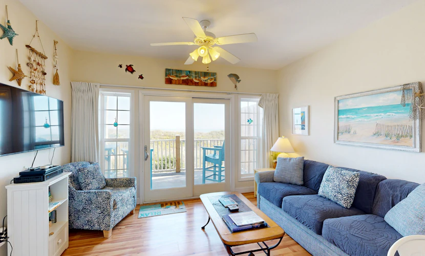 Inviting beachfront condo featuring hot tub & pool, central AC, elevator, & deck