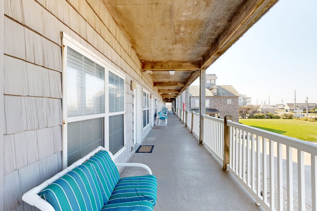 Inviting beachfront condo featuring hot tub & pool, central AC, elevator, & deck