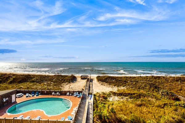 Sun-kissed beachfront condo with central AC, pool/hot tub access