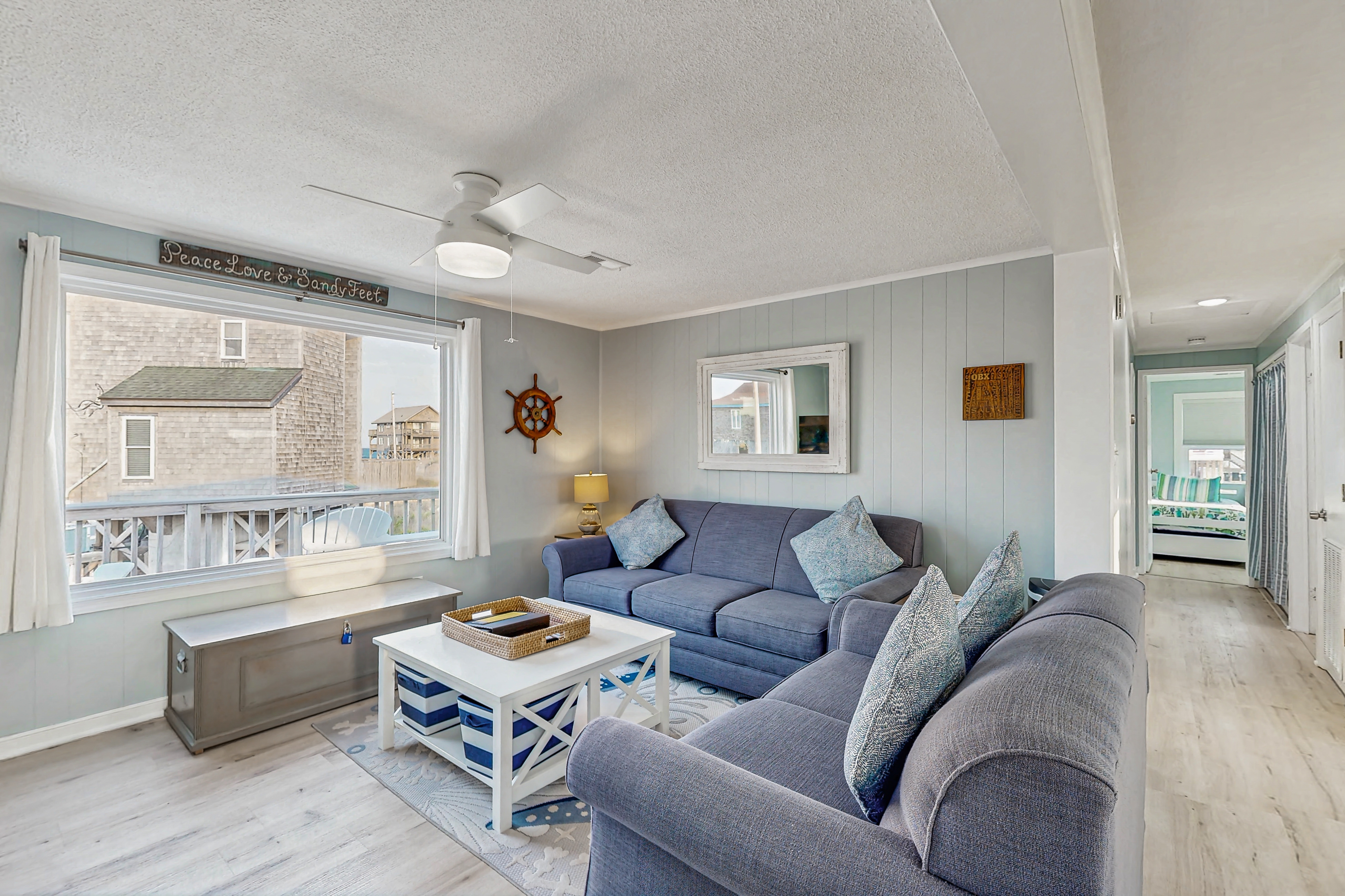 Ocean-view home steps from the beach with deck, outdoor shower, & central AC