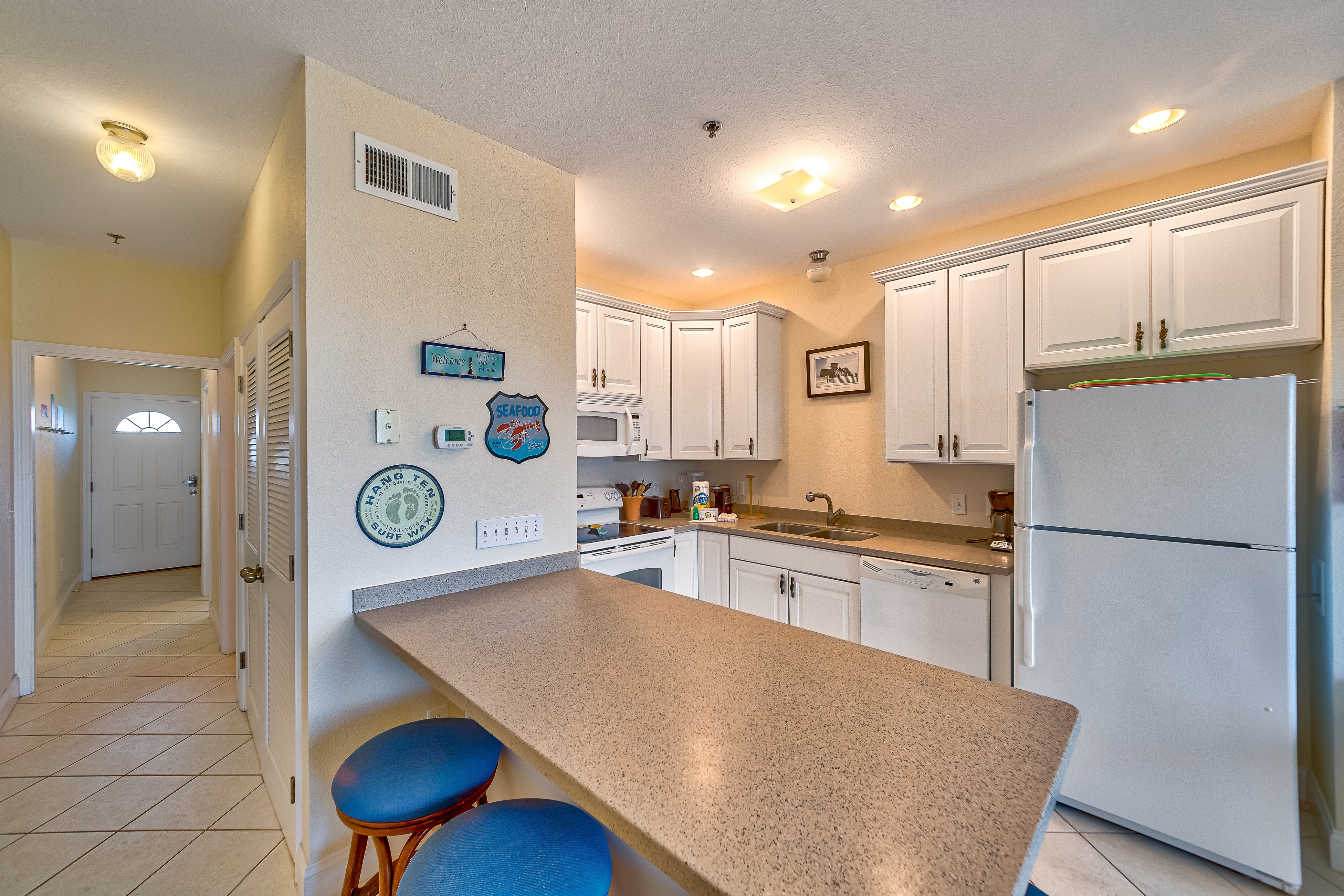 Dog-friendly oceanfront condo with balcony, outdoor pool, hot tub, and central AC