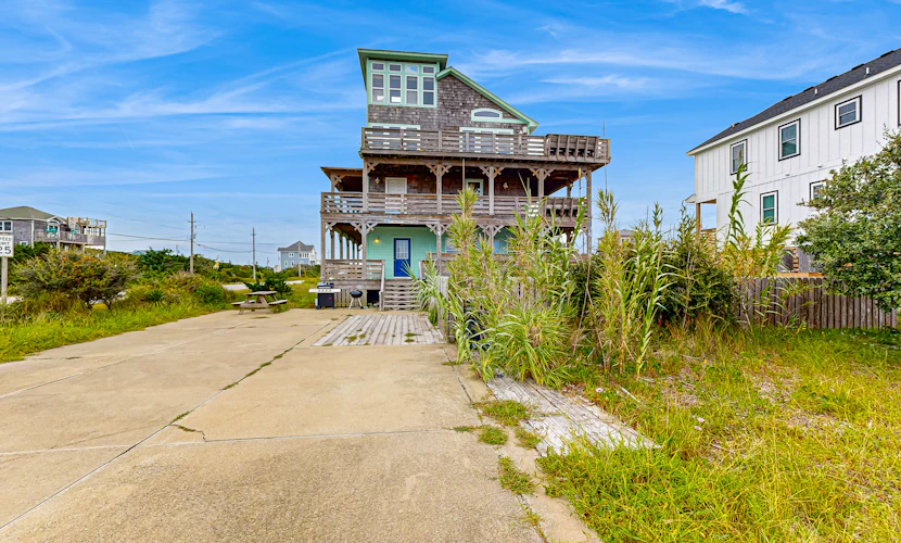 Towering beach house with private pool, hot tub, decks & ocean views