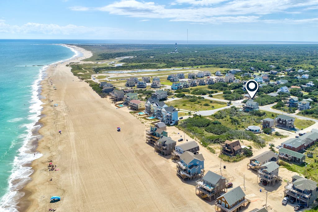 Towering beach house with private pool, hot tub, decks & ocean views