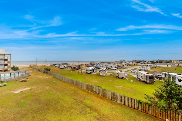 Ocean view condo with pool access, furnished balcony, & central AC