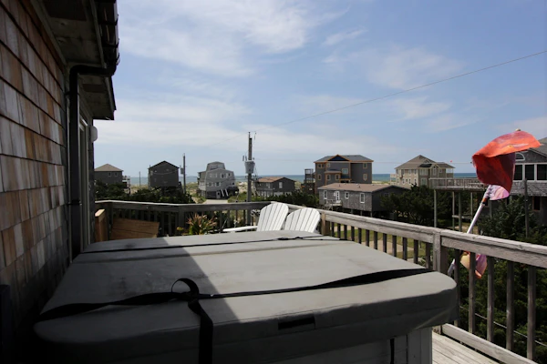 Fun home with ocean view, washer/dryer, outdoor pool access, and private hot tub