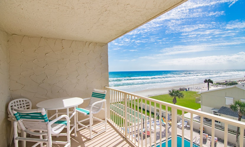 Oceanfront Relaxation with Balcony, Pool & Steps to Dining
