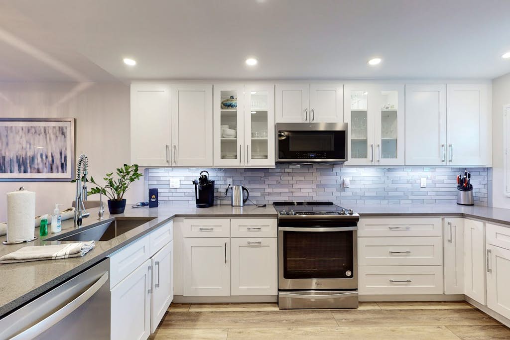 Modern Coastal Condo w/ Balcony, Pool & Easy Walk to the Beach