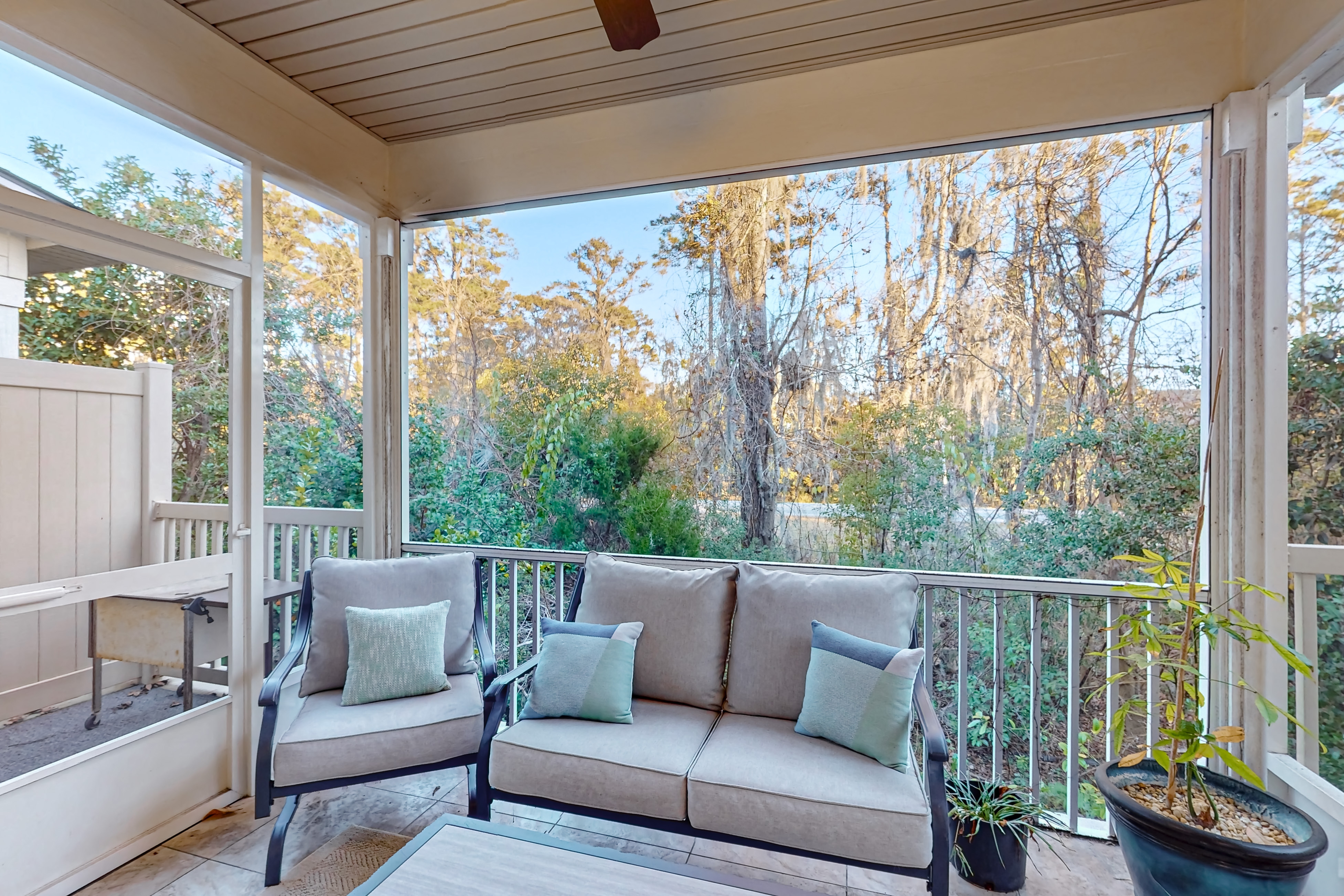 Cozy island townhouse w/screened porch, shared pool, & serene pond views