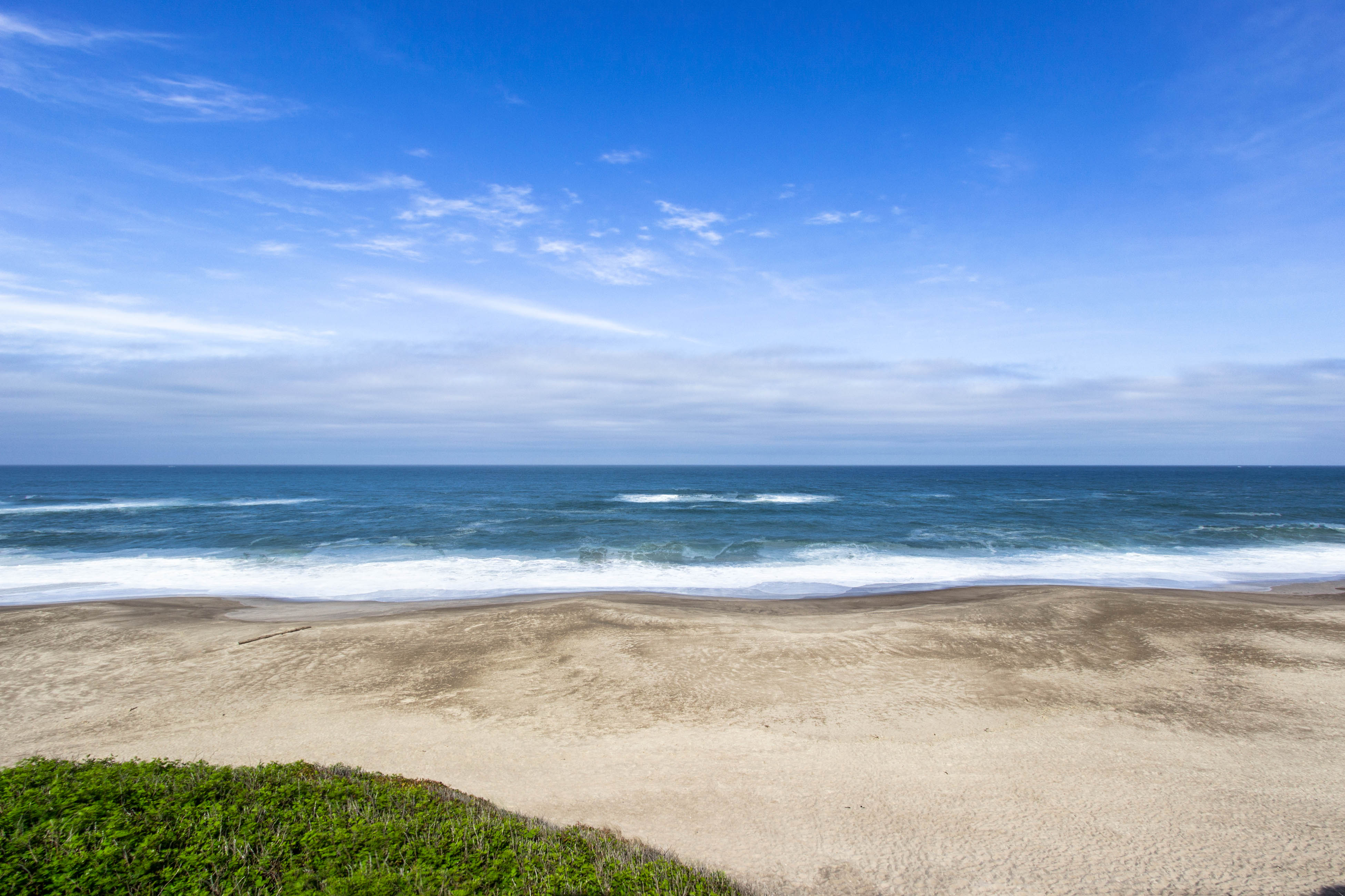 Dog friendly home with oceanfront location and fireplace walk to the beach