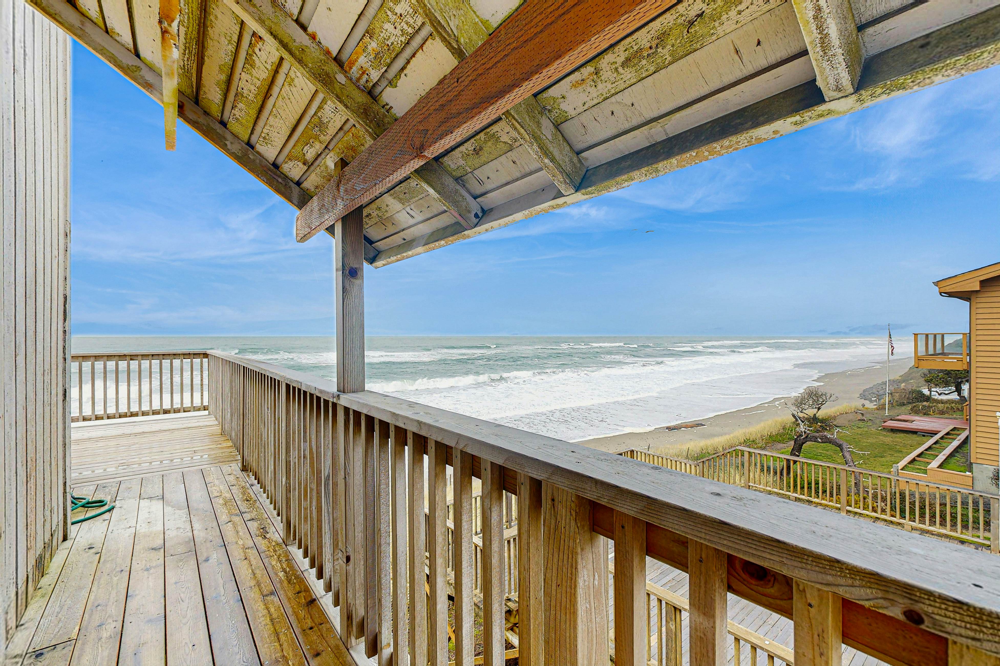 Dog-friendly home with oceanfront location & fireplace - walk to the beach