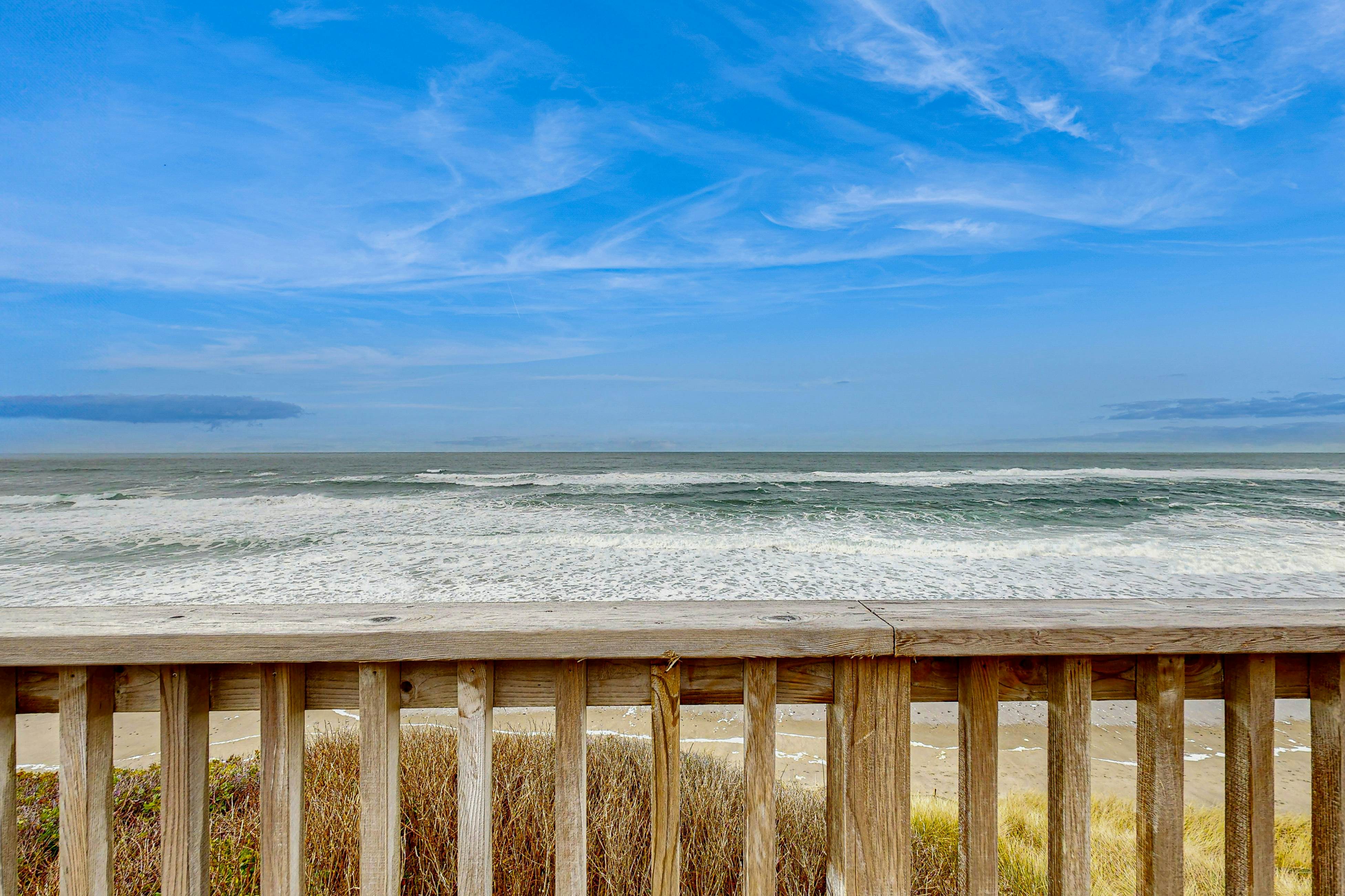 Dog-friendly home with oceanfront location & fireplace - walk to the beach