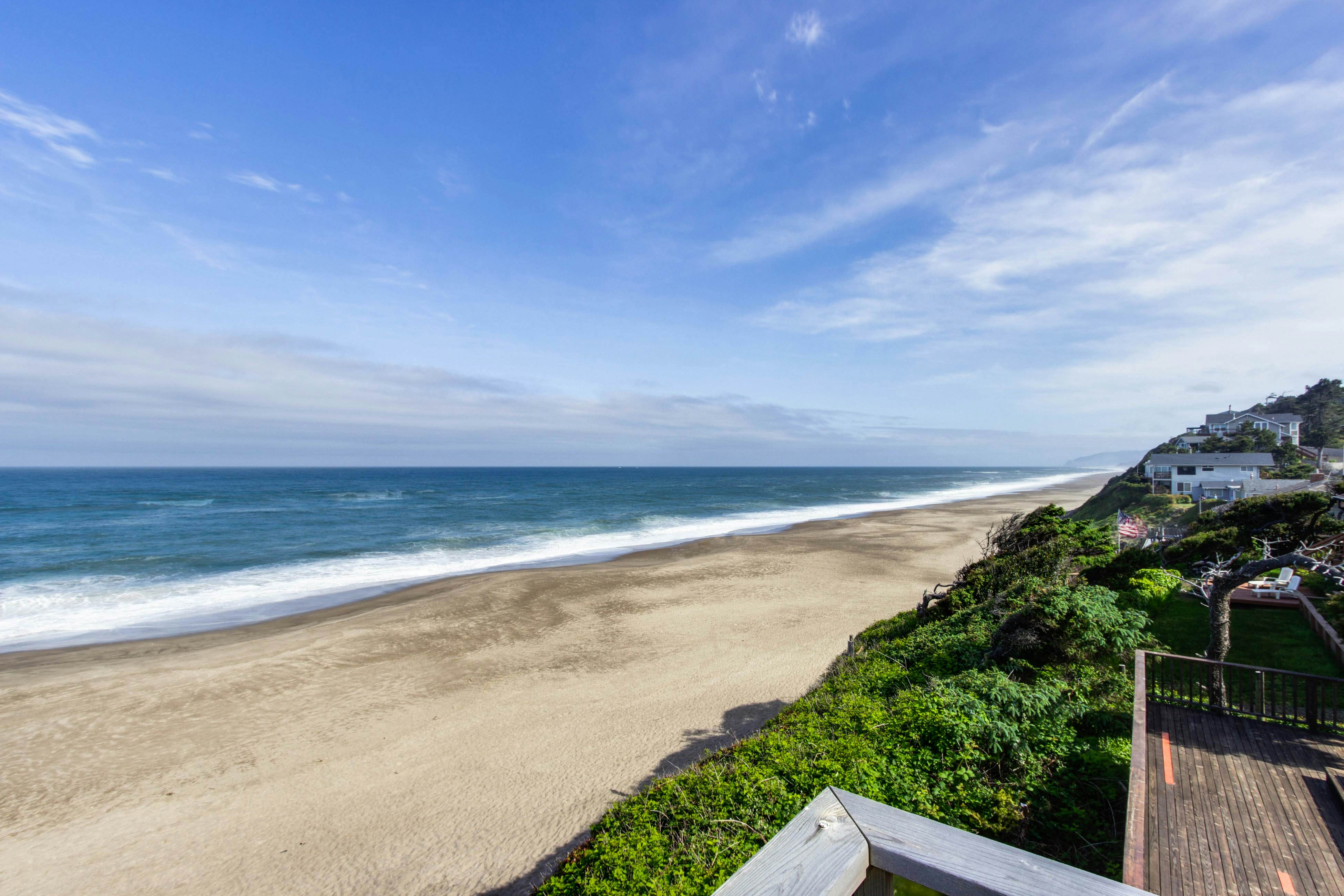 Dog-friendly home with oceanfront location & fireplace - walk to the beach