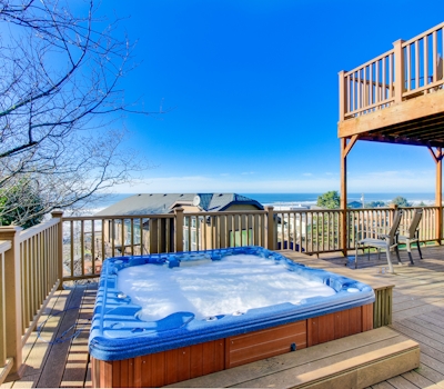 Sunlit home with gorgeous ocean views big decks and hot tub