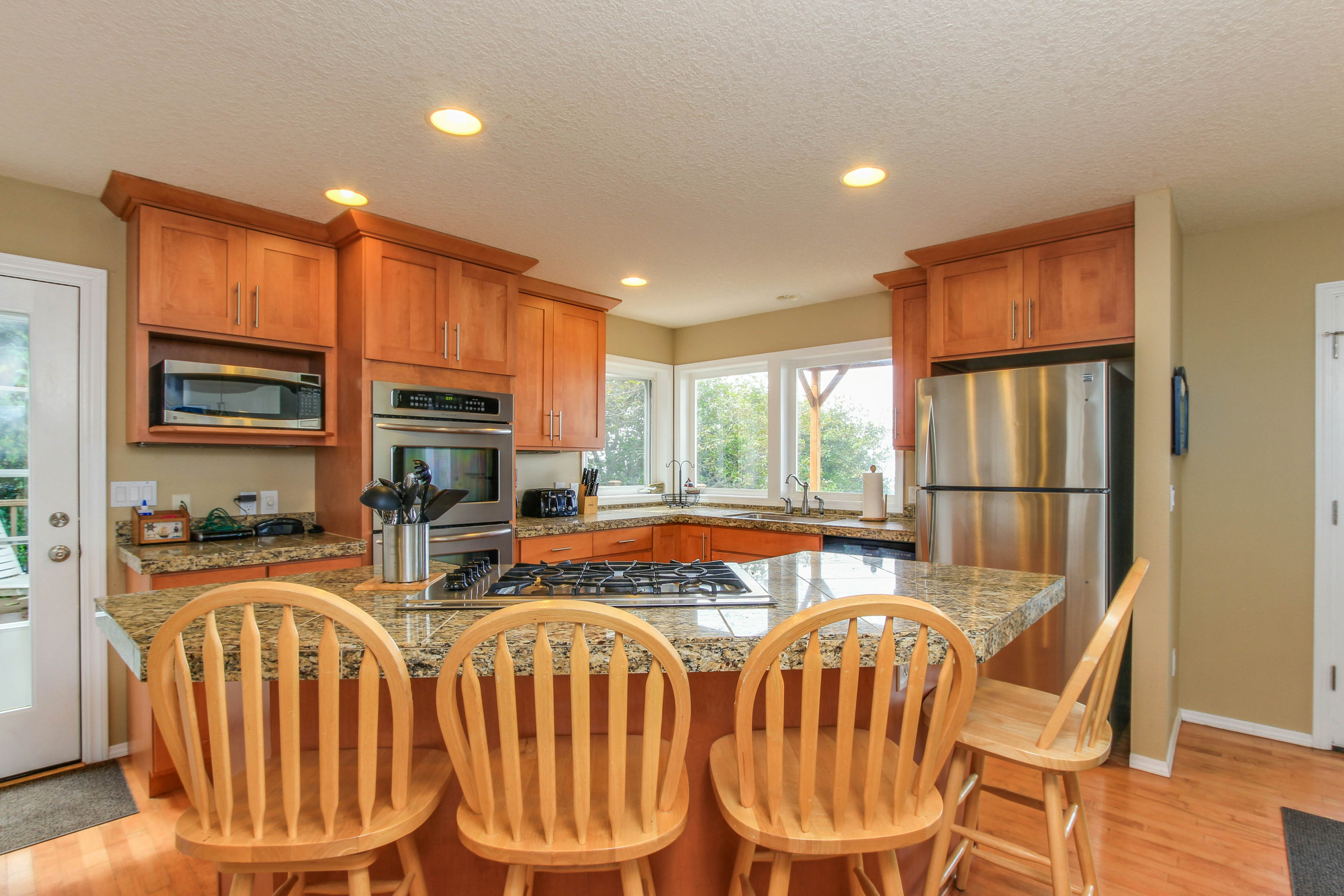 Sunlit home with gorgeous ocean views big decks and hot tub