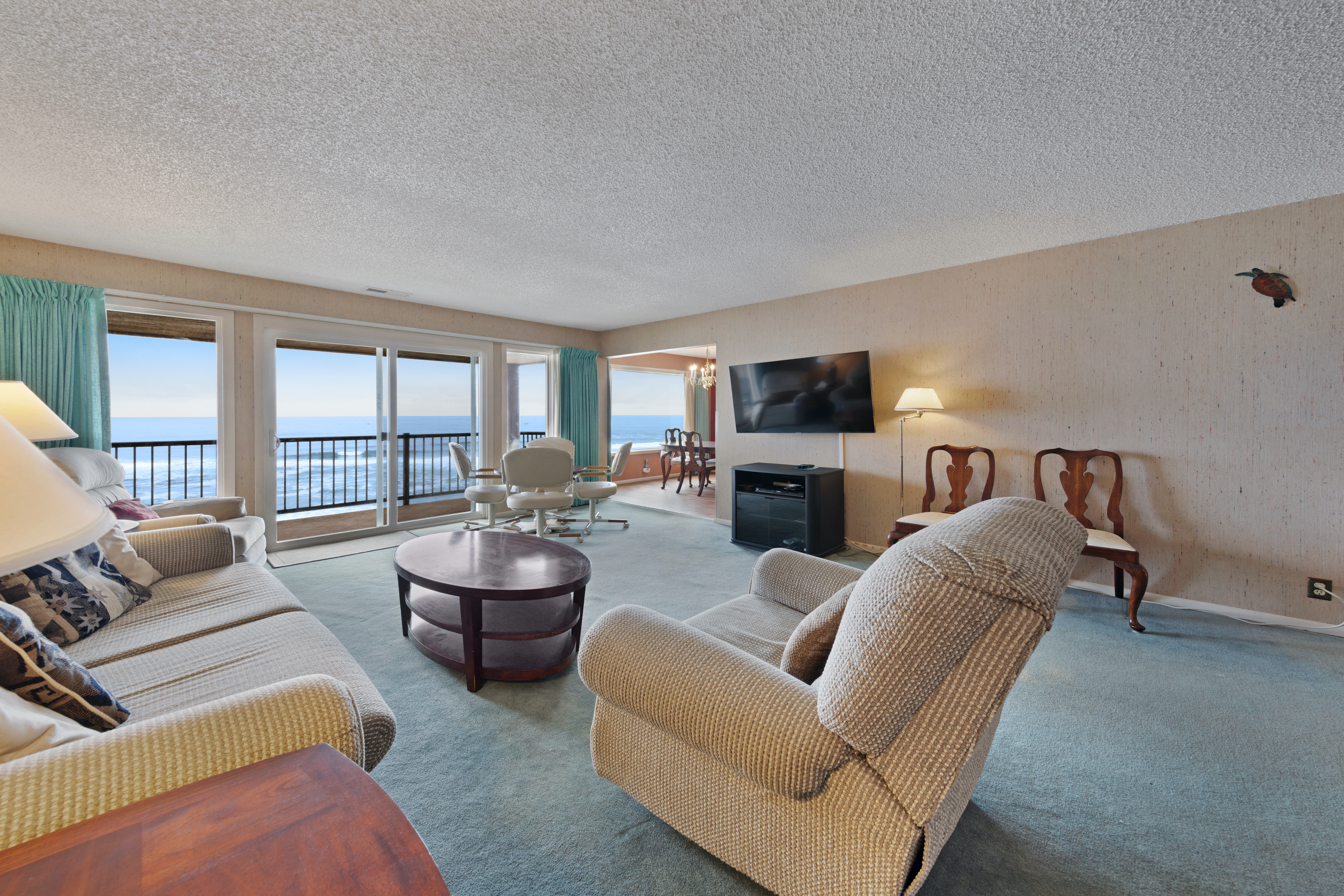 Lovely oceanfront condo with sweeping water views and balcony