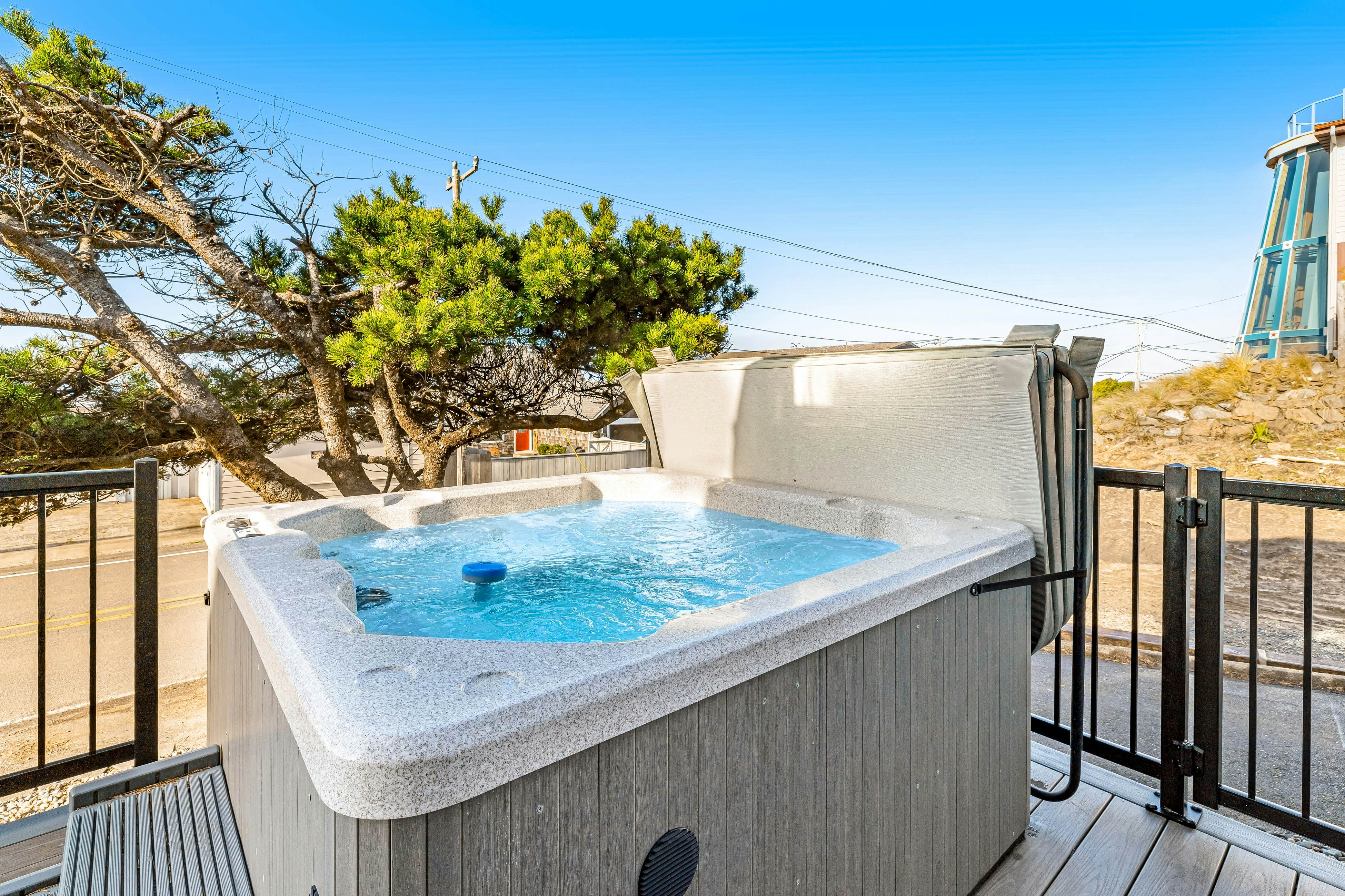 Bright home with stunning ocean views private hot tub and nearby beach access