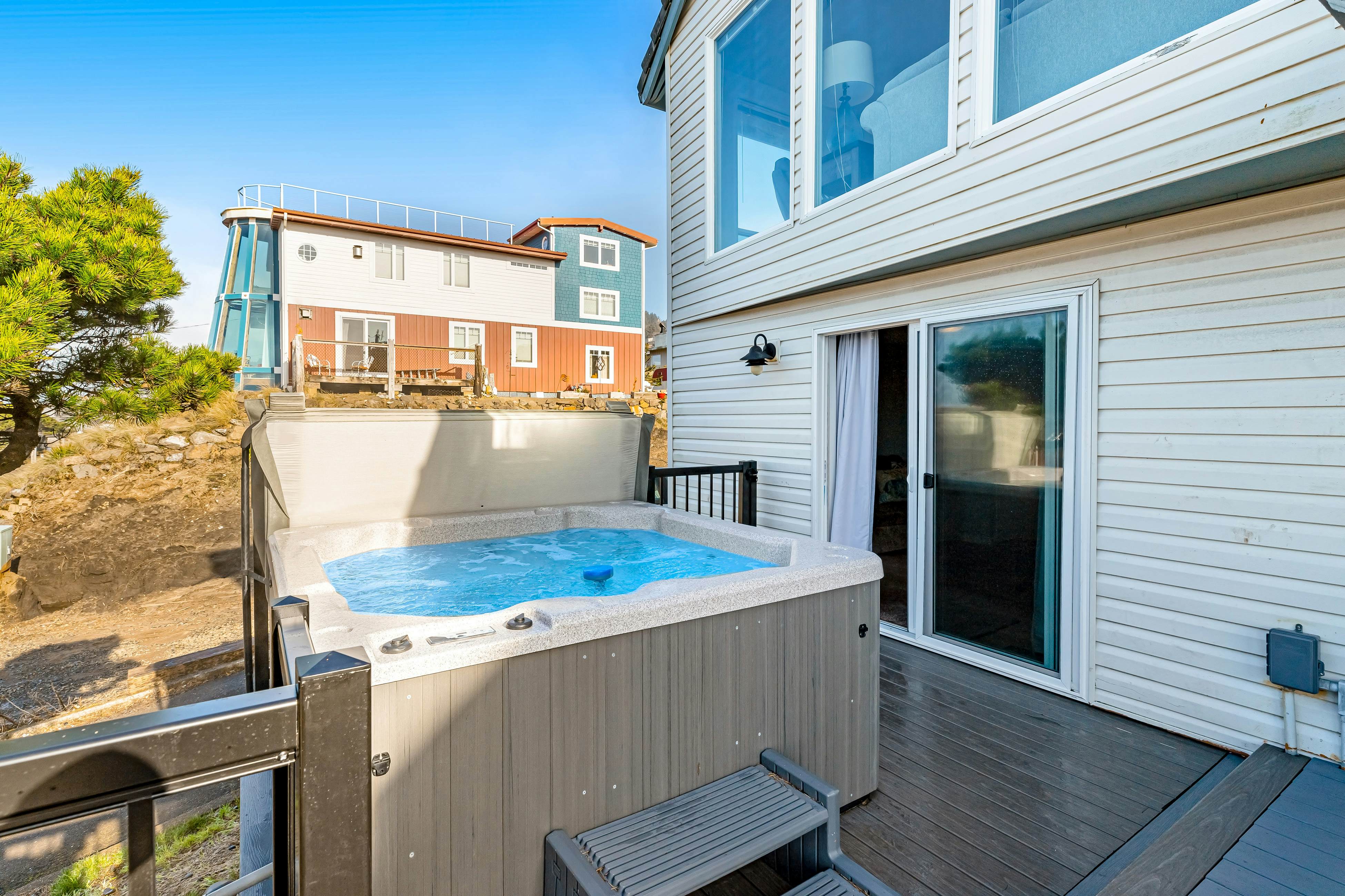 Bright home with stunning ocean views private hot tub and nearby beach access