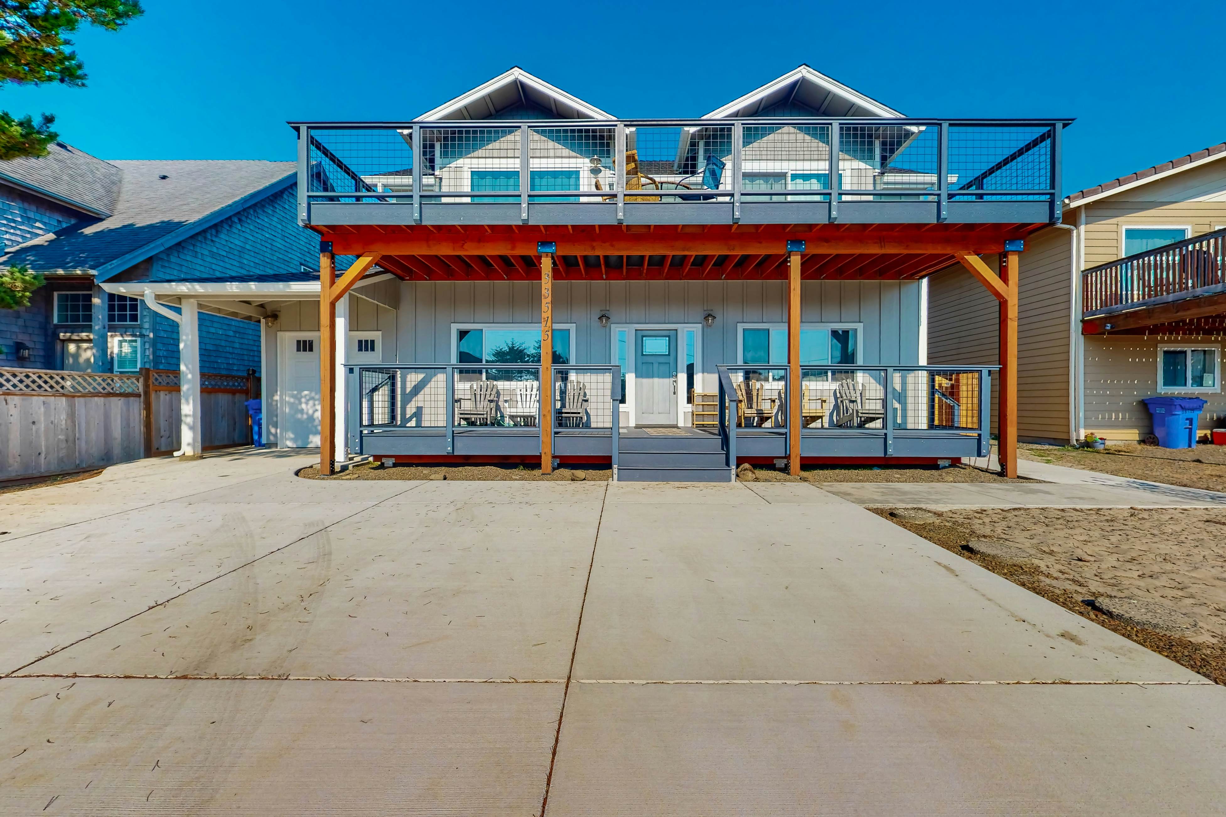 Costal Home a block from the beach with two-story deck, firepit, large yard
