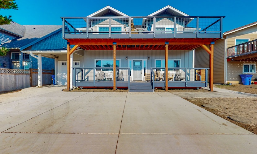 Costal Home a block from the beach with two story deck firepit large yard