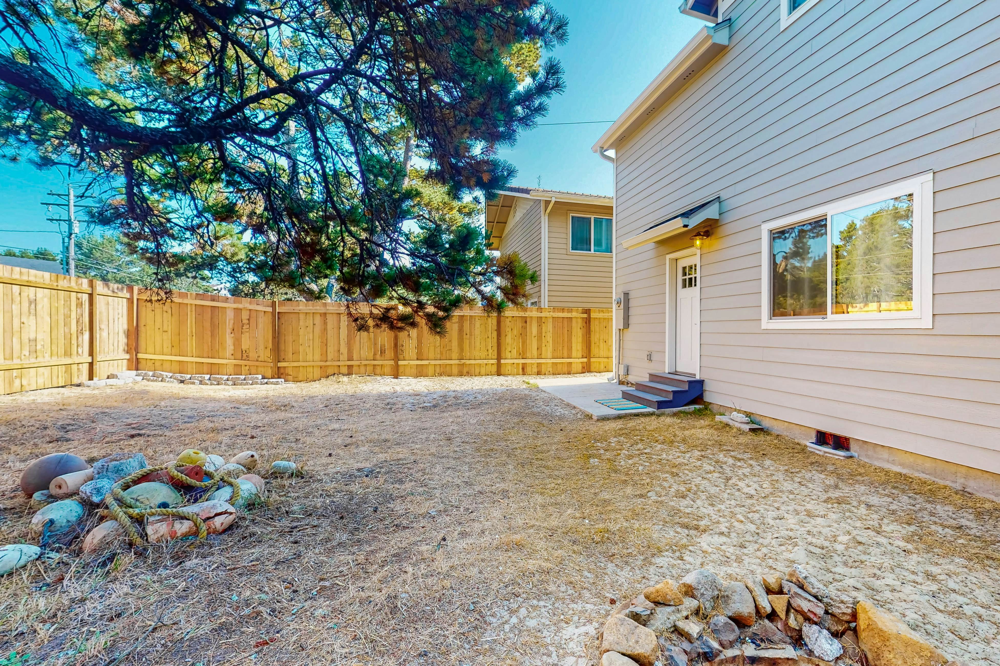 Costal Home a block from the beach with two-story deck, firepit, large yard