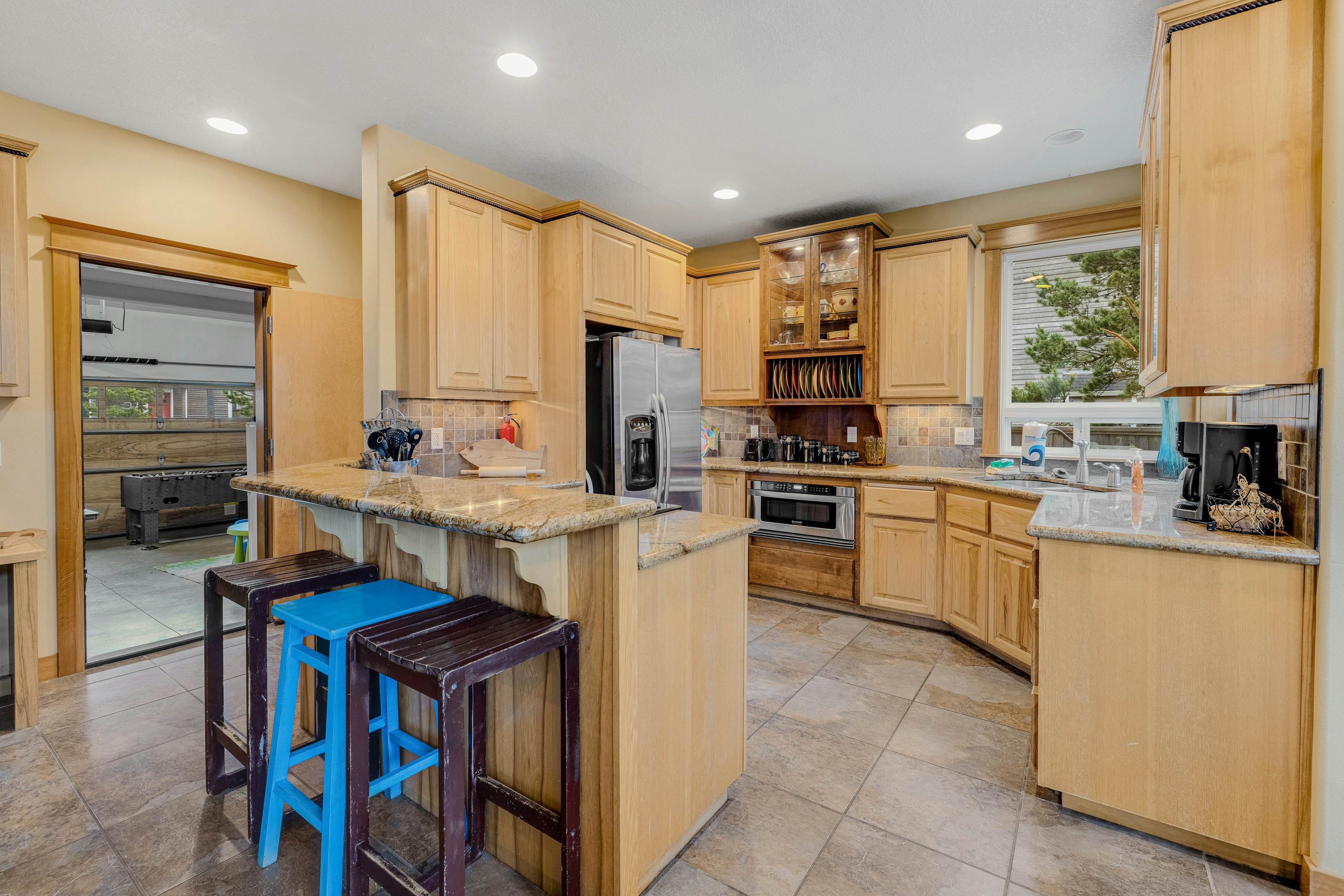 Dog-friendly coastal retreat with a game room, patio, grill, jetted tub, & W/D