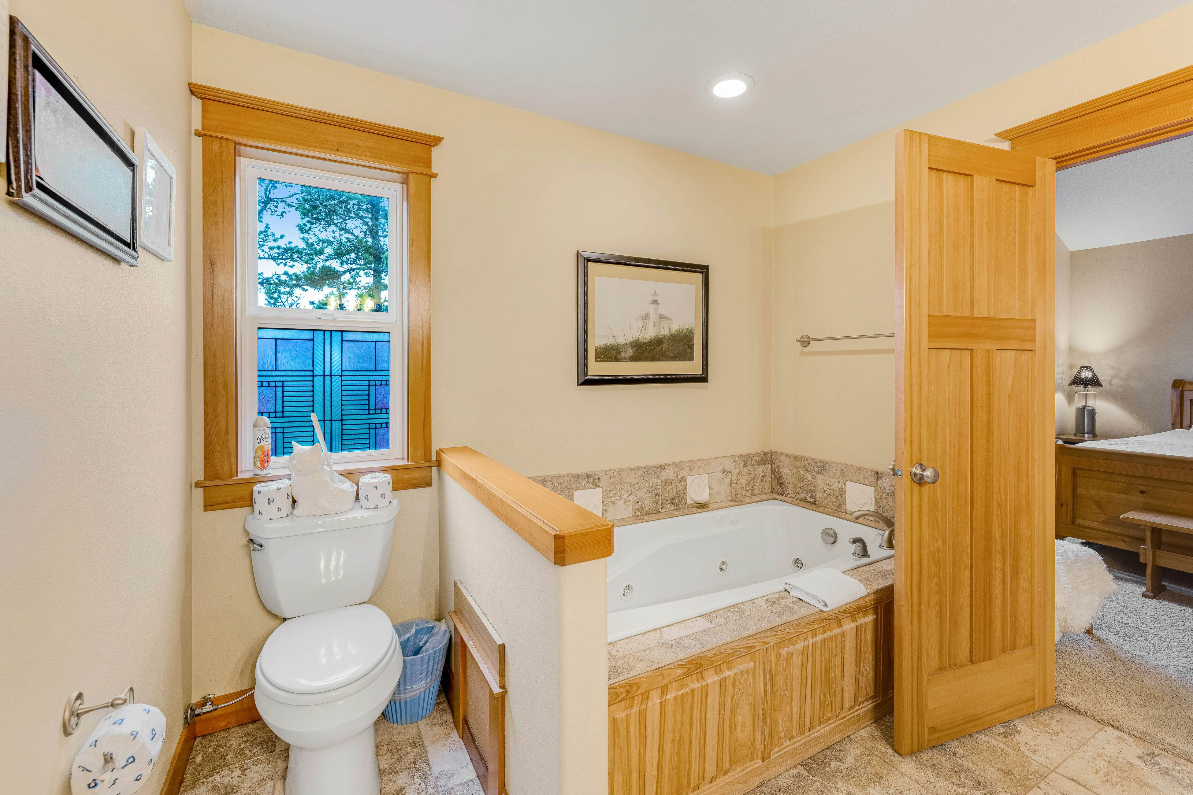 Dog-friendly coastal retreat with a game room, patio, grill, jetted tub, & W/D