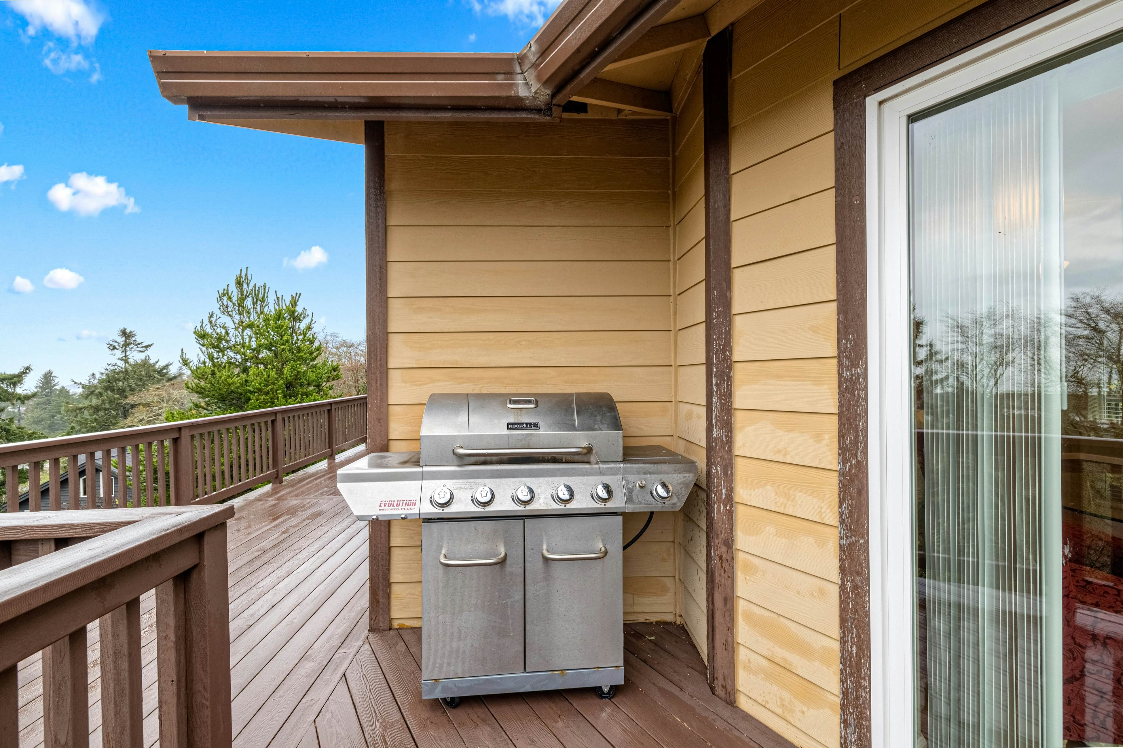 Three-story ocean view home with balconies, grill, & open layout - dog-friendly