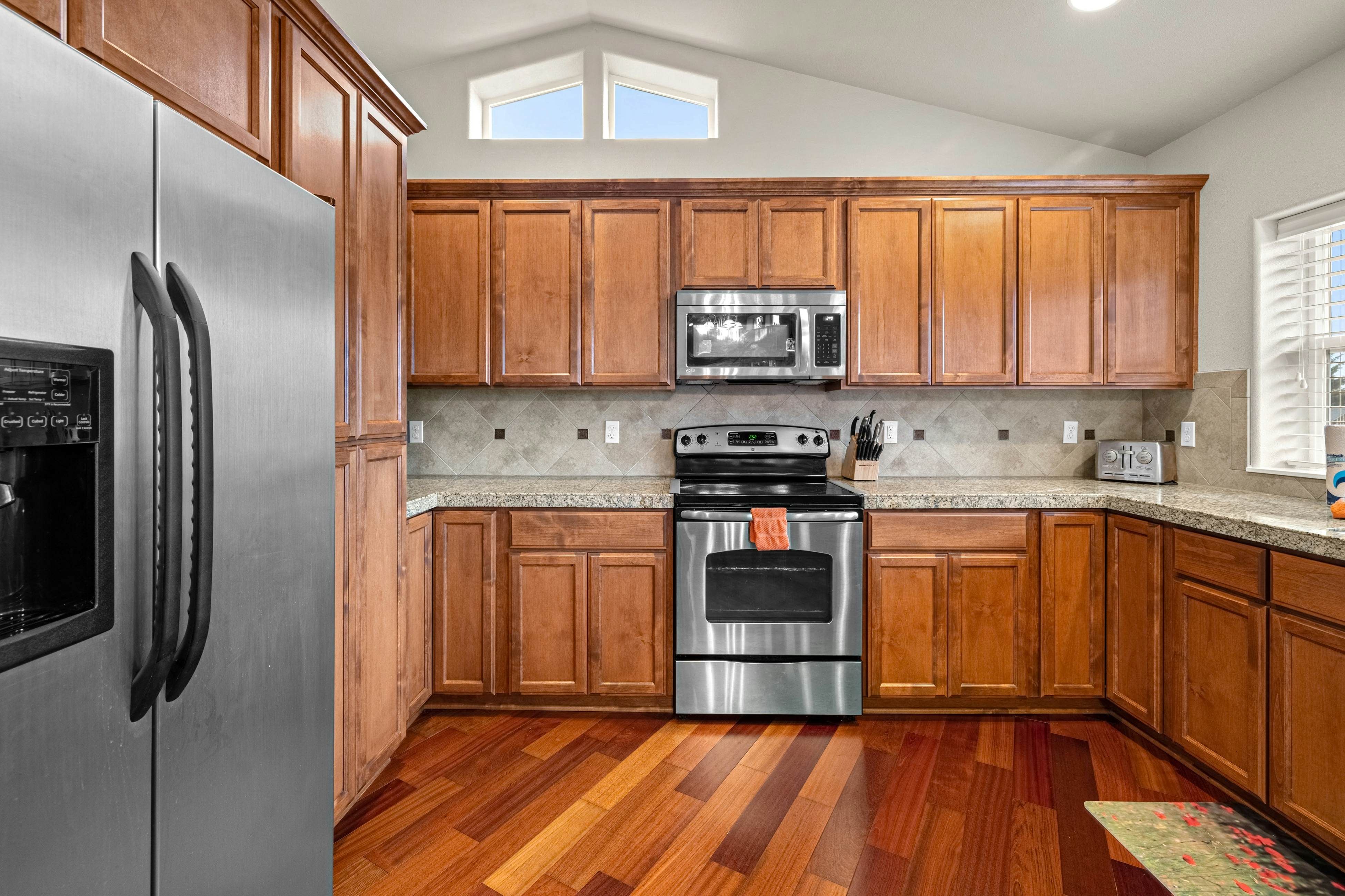 Three-story ocean view home with balconies, grill, & open layout - dog-friendly