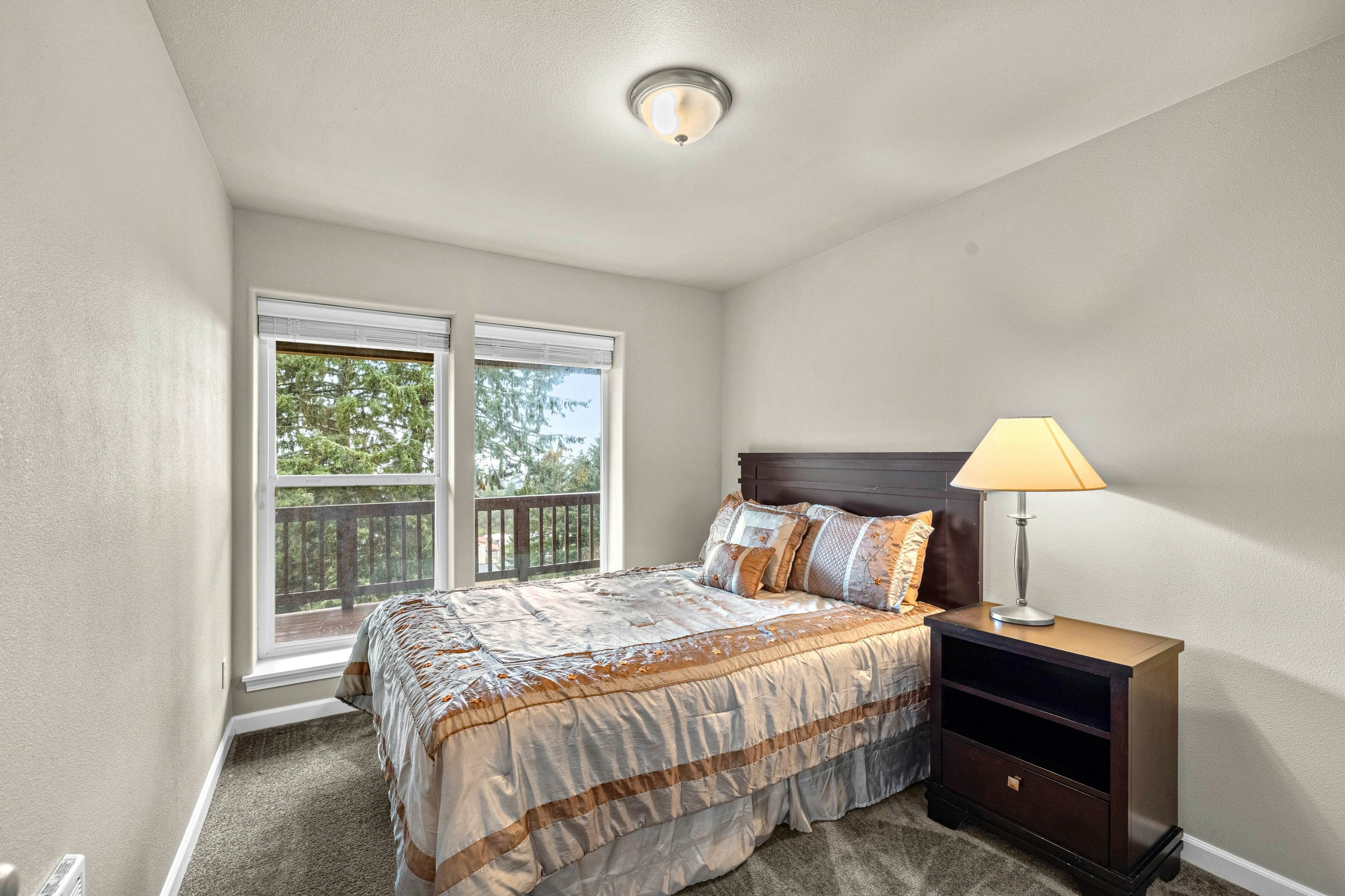 Three-story ocean view home with balconies, grill, & open layout - dog-friendly