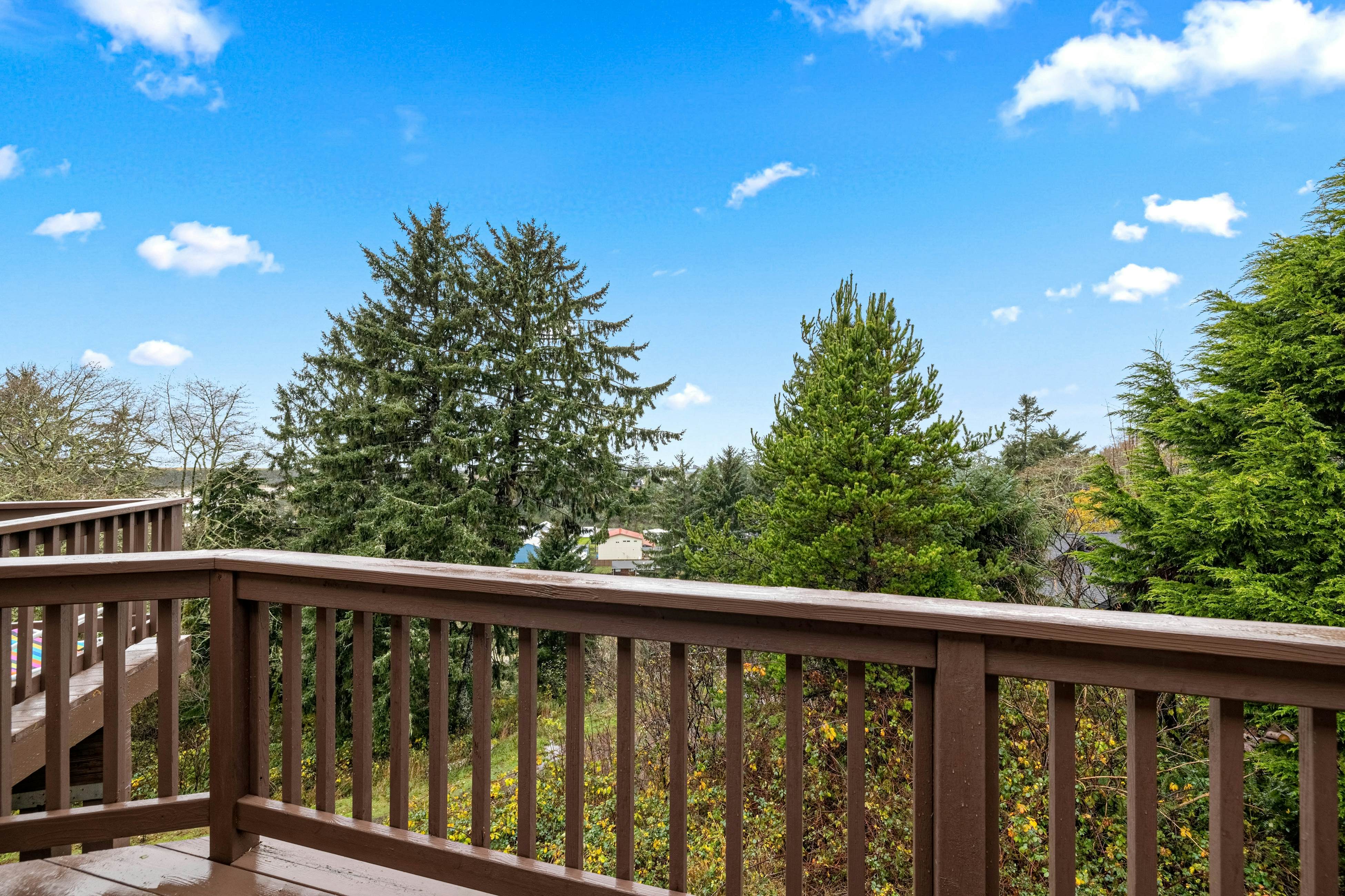 Three-story ocean view home with balconies, grill, & open layout - dog-friendly