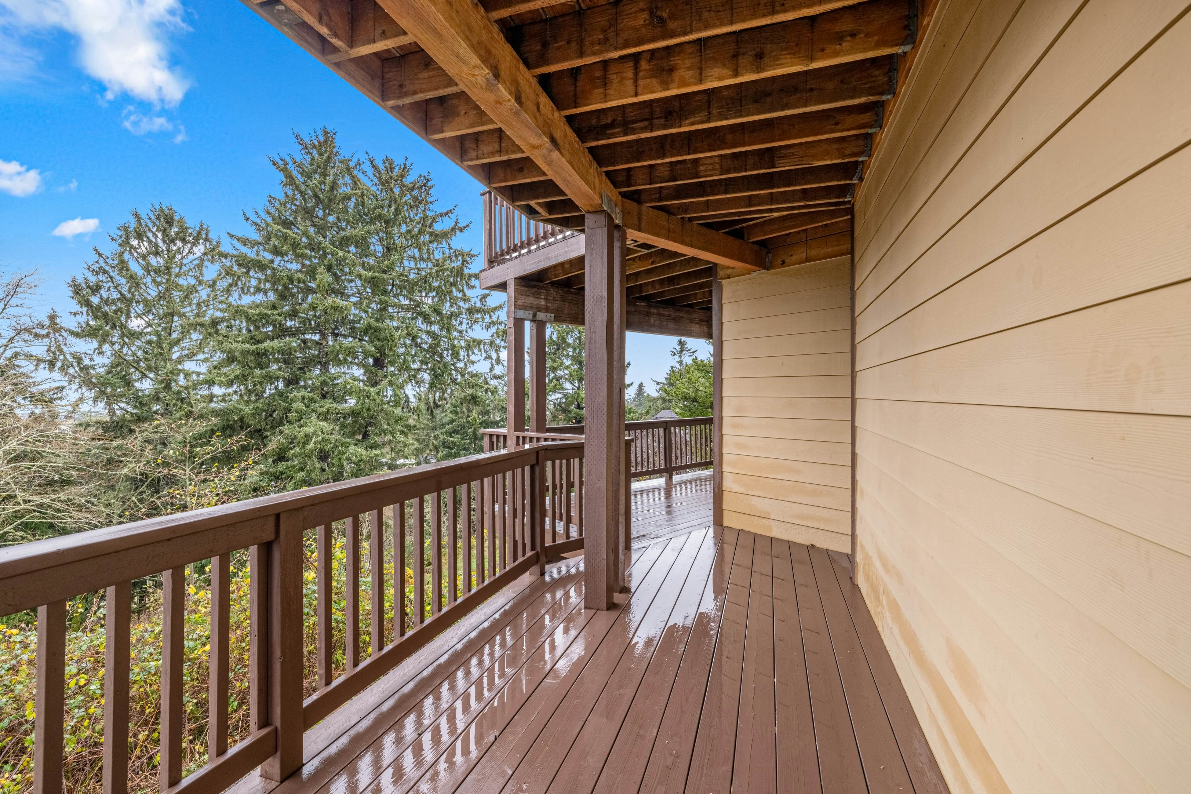 Three-story ocean view home with balconies, grill, & open layout - dog-friendly