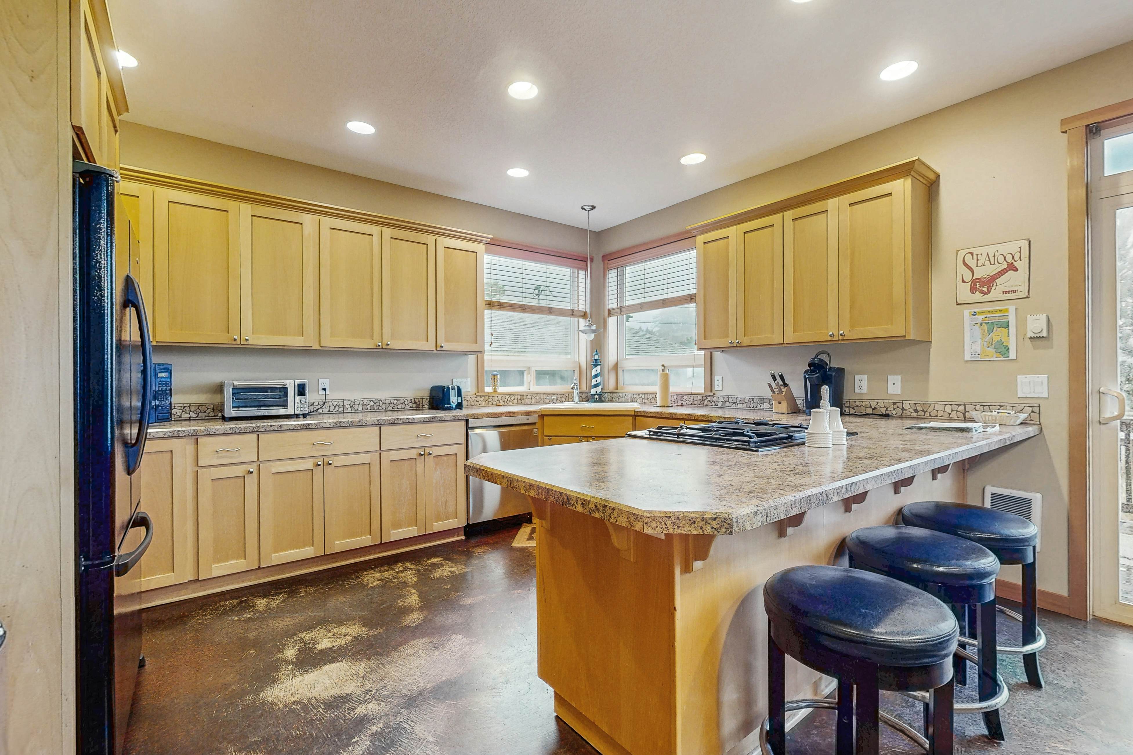 Family-friendly home with private hot tub, fireplace, & BBQ, close to beach