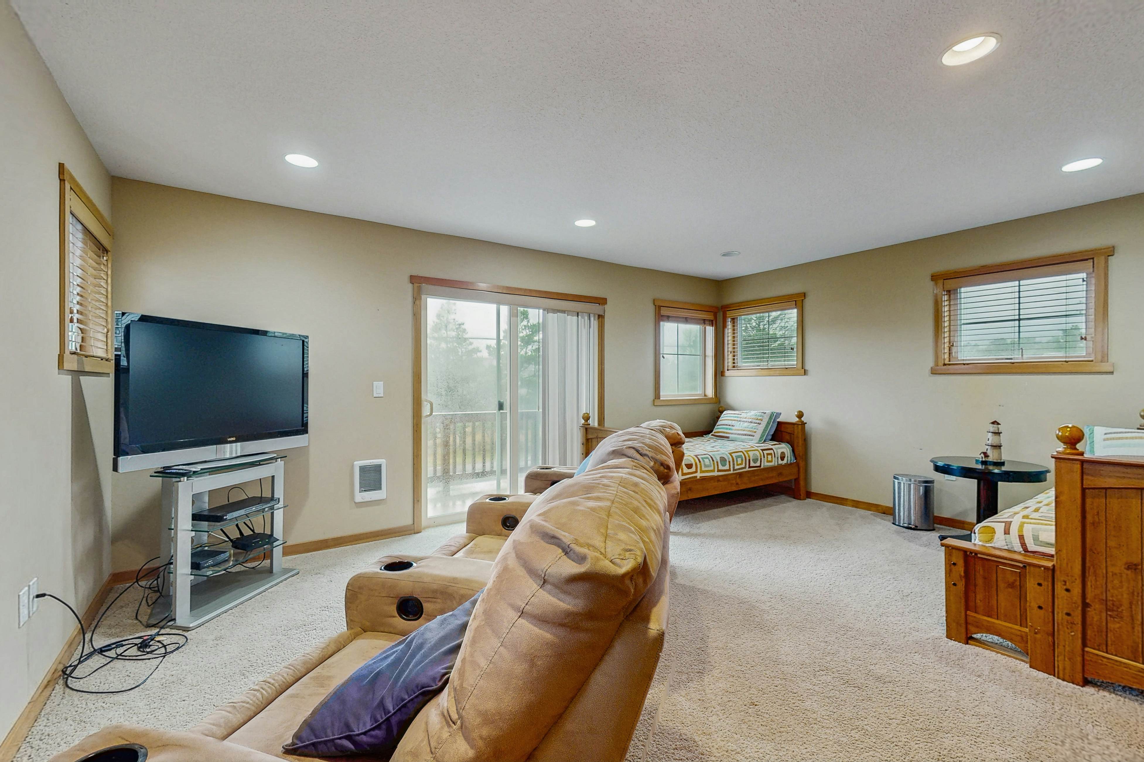 Family-friendly home with private hot tub, fireplace, & BBQ, close to beach