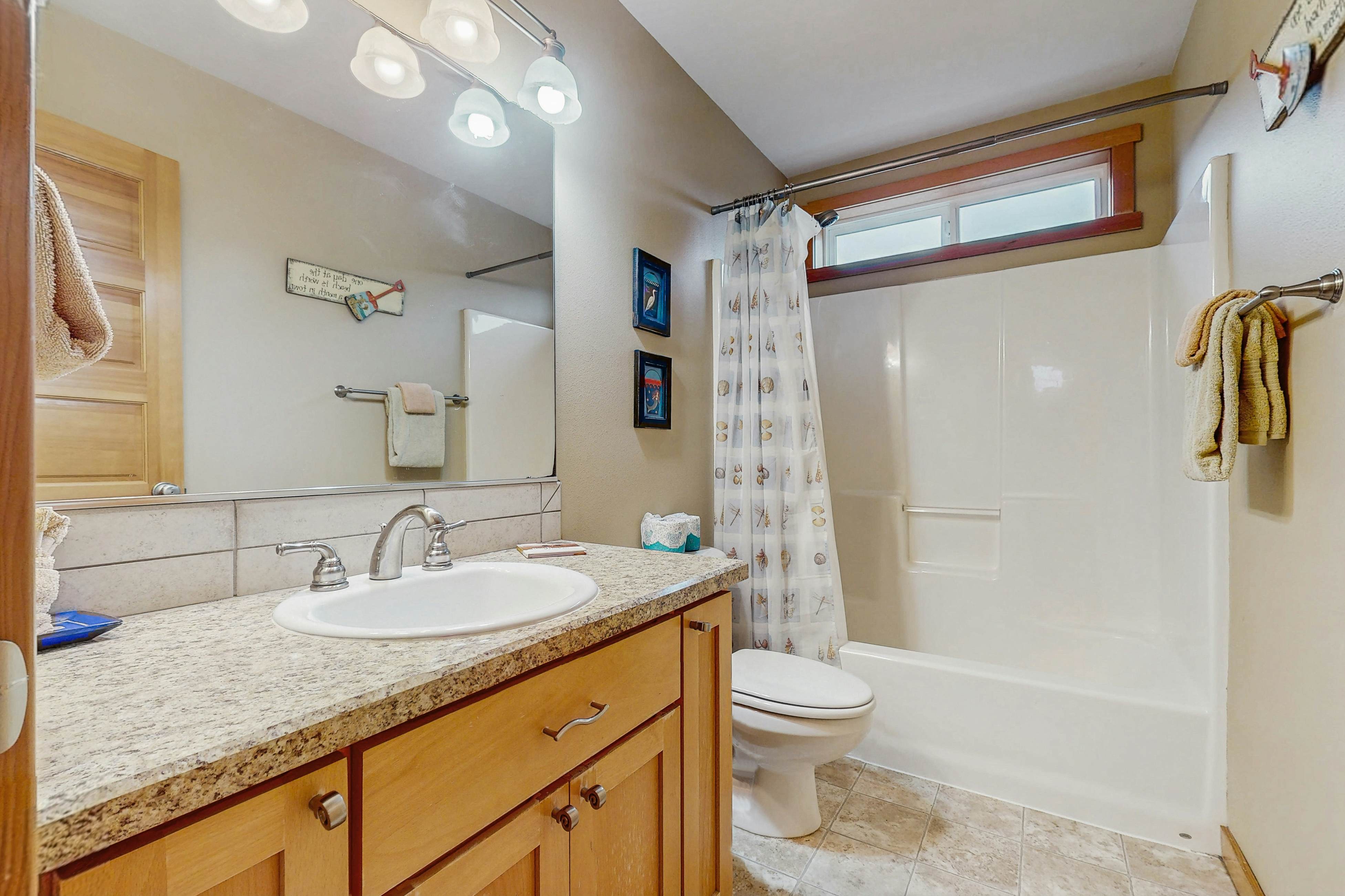 Family-friendly home with private hot tub, fireplace, & BBQ, close to beach