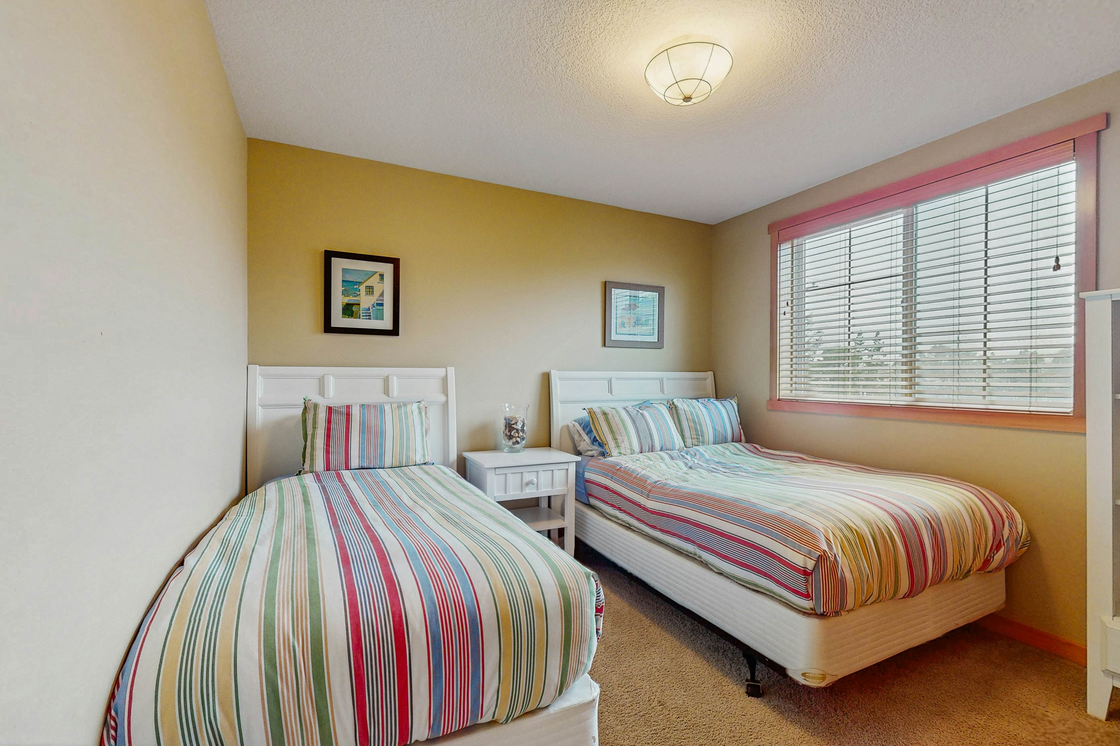 Family-friendly home with private hot tub, fireplace, & BBQ, close to beach