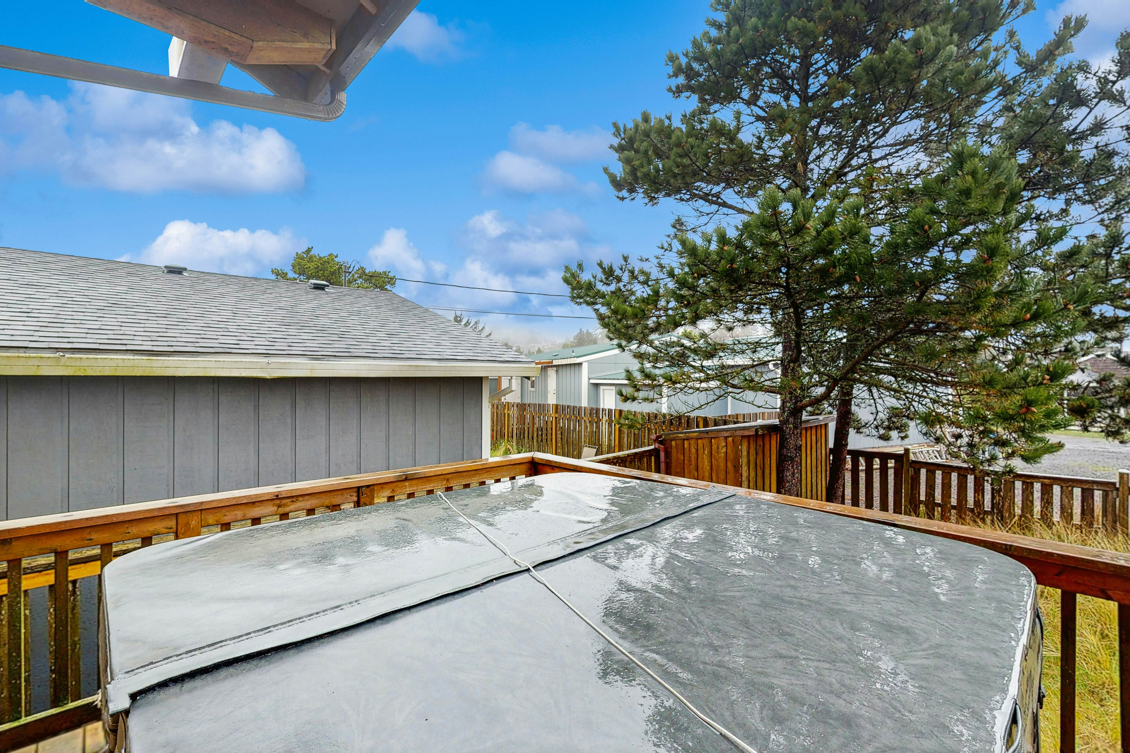 Family-friendly home with private hot tub, fireplace, & BBQ, close to beach